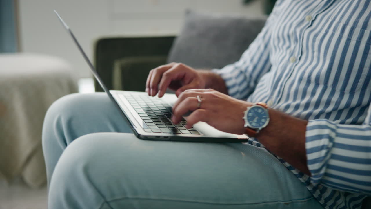 Man working on laptop at home