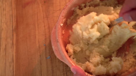 mashing potatoes in a rustic setup