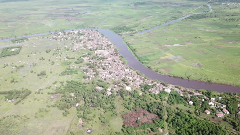 wide shot of village along oueme river in benin