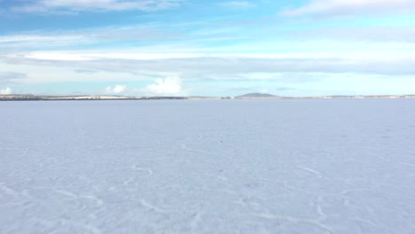 excellent aerial shot of the frozen over lake greenly on eyre peninsula, south australia shadowed by clouds