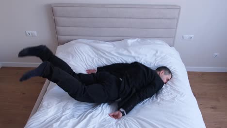 a tired guy an office worker goes to bed without undressing a tired guy an office worker goes to bed without undressing an overtired man after a hard days work video