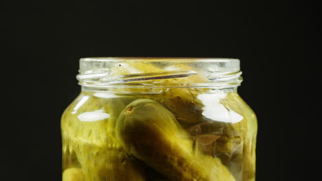 pickled cucumbers in a jar