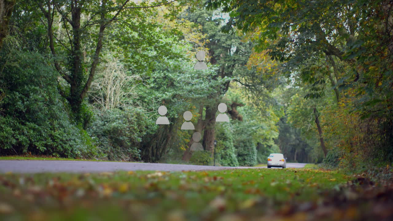 Animation of car driving on forest road with social media icons floating