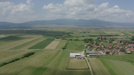 Farming-Landscape-Under-Cloudy-Sky-Near-Delnita,-Romania