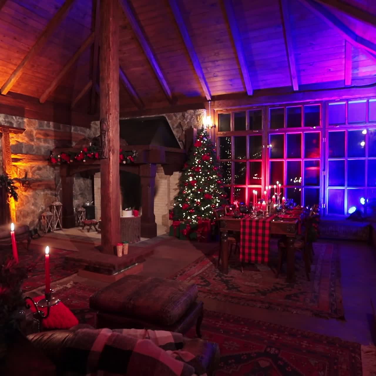Large and cozy room in a country mansion prepared for celebrating Christmas. Beautiful festive interior in a village house of stone and wood