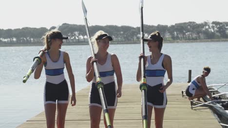 female rowing team training on a river