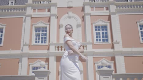 elegant bride in front of a chateau