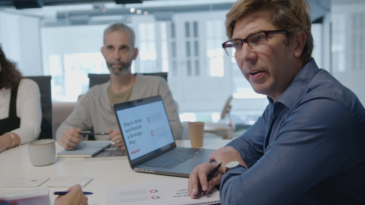 Executive Manager Holding Office Meeting with Senior Business Team