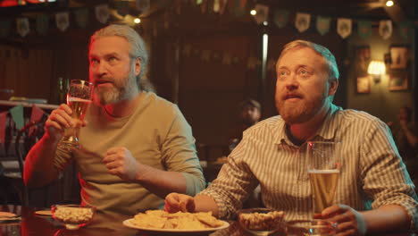 men watching football match