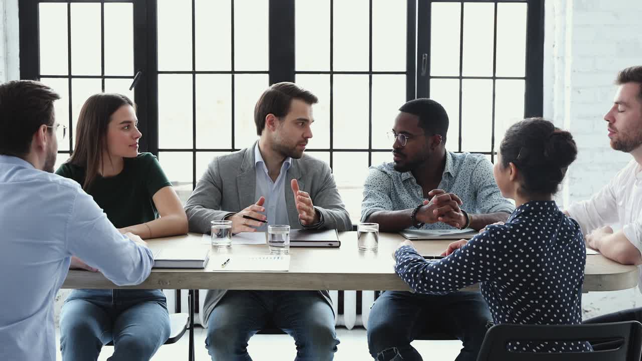 Businessman coach training staff explain new strategy at briefing table