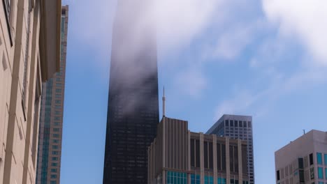 chicago timelapse looking east towards john hancock building with fog clearing up