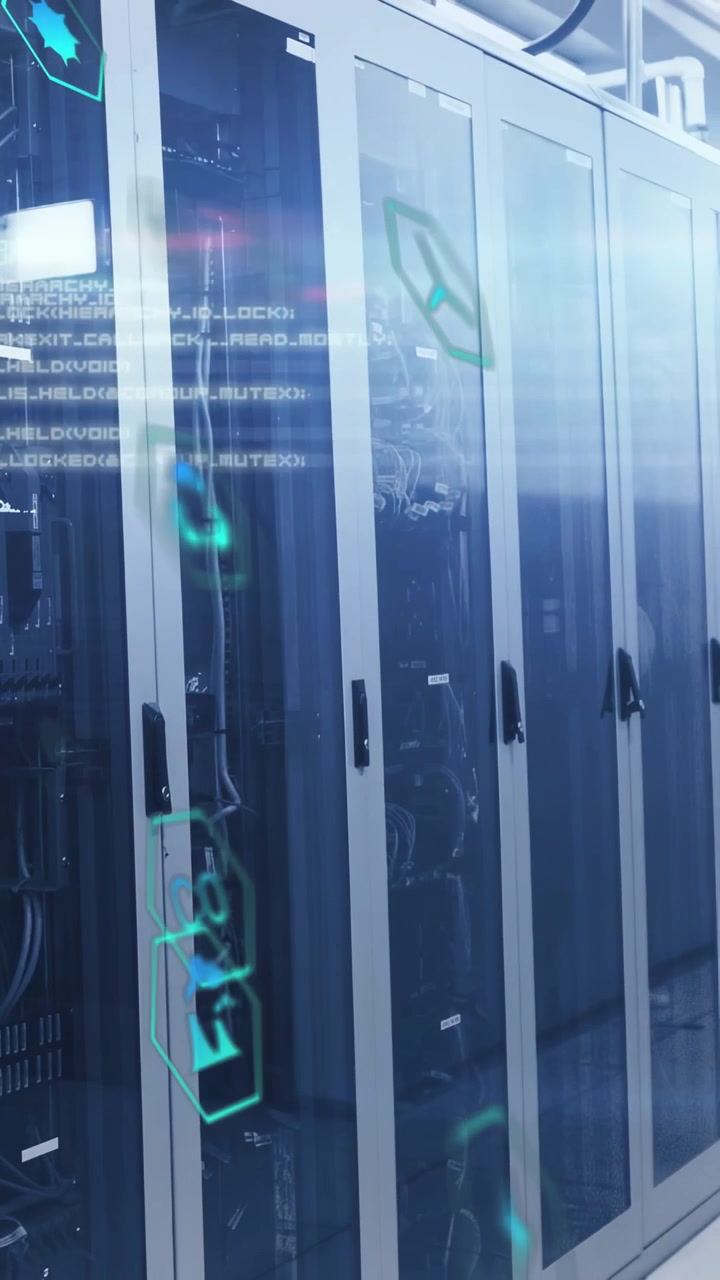 Vertical video: On camera panning right, server racks filling frame, cyan holograms showing status