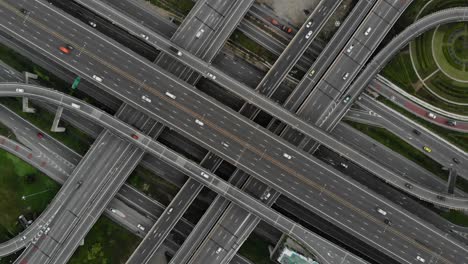 high angle looking top down view of complicate road and expressway intersection in bangkok city of thailand. shot by drone can use for transportation or abstract concept.