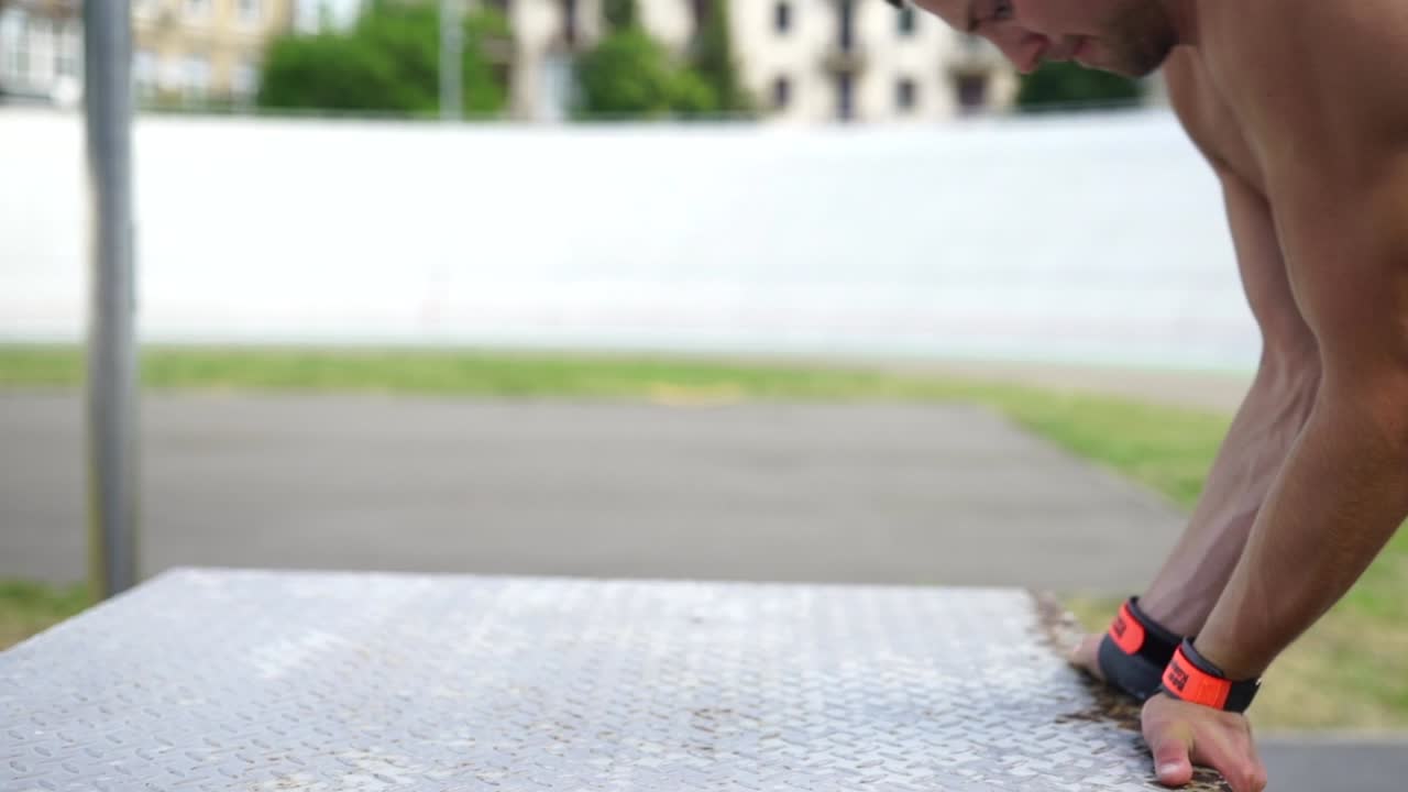 Man Performing Handstand Push-ups Outdoor