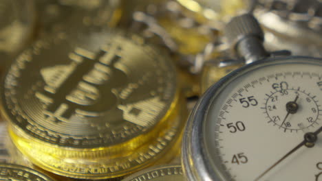 bitcoin and analogue metal stopwatch