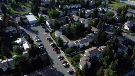 real estate drone shots above townhouses in calgary during summertime, canada