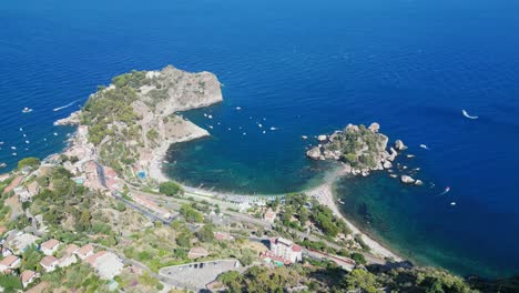 isola bella island and beach in taormina, messina, sicily, italy - aerial 4k tilting down