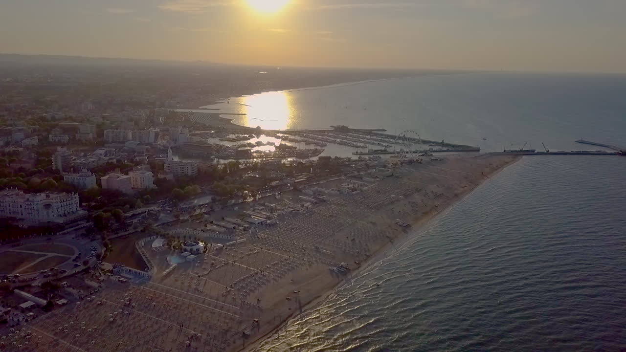 Aerial View of the Beach between Rimini and Riccione in Emilia Romagna At Sunset In Italy - drone shot