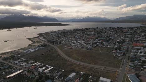 aerial view of houses landscape, sea during sunny day in puerto natales, chile, scenic antarctic patagonia, gulf montt