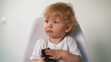 little toddler with white hair and blue eyes