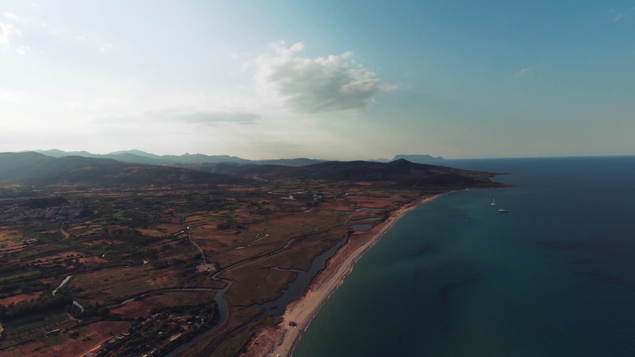 Fast zoom out of aerial view of the coast in Sardinia
