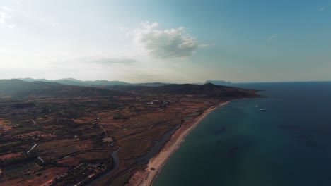 fast zoom out of aerial view of the coast in sardinia