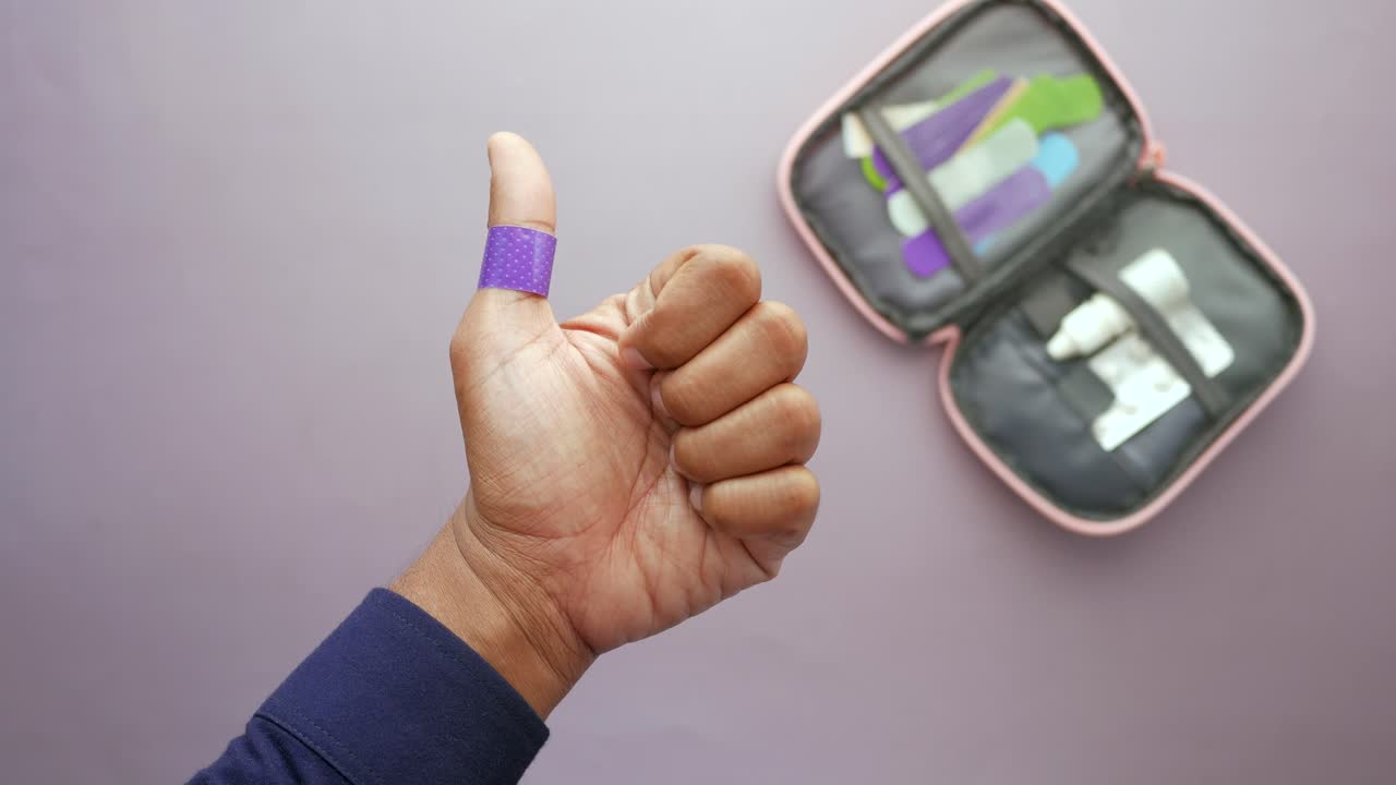 Blue  adhesive bandage on hand ,