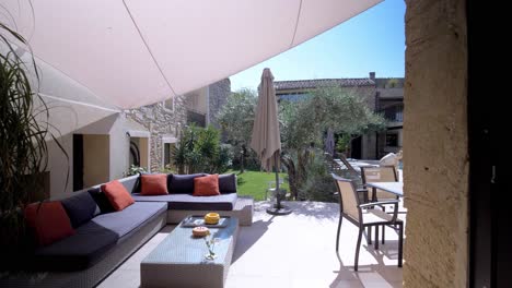 slow revealing shot of a luxury garden with a seating area and private pool