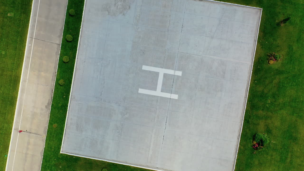 Helicopter landing site. Aerial view of a large modern industrial factory.