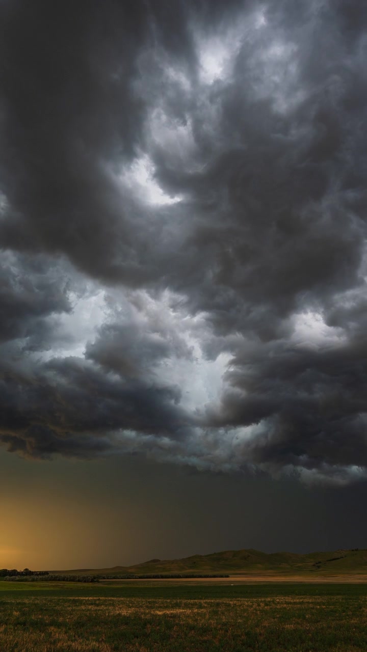 Powerful dark clouds swirling and drifting in a dramatic storm sky scene