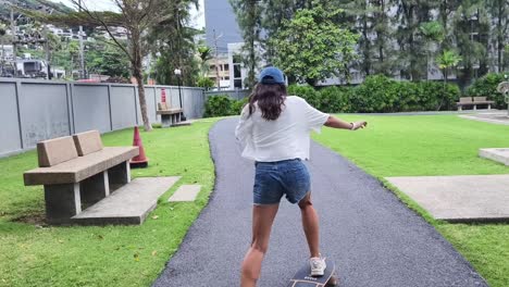 woman skateboarding in a park