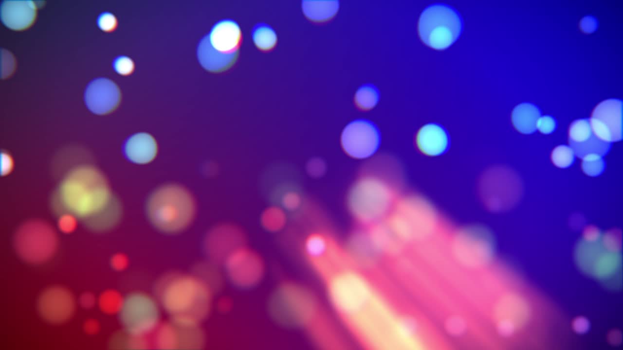Animação de bokeh azul e vermelho com raios e partículas desfocadas flutuantes