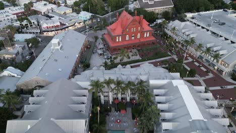 aerial drone revealing key west in florida during sunset with duval street