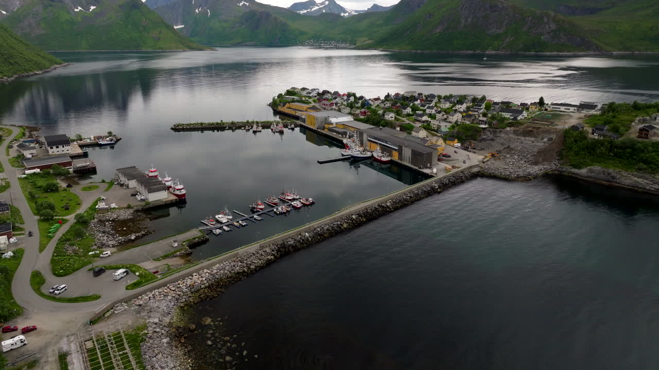 Causeway between Senja and quaint fishing village of Husoy island, Norway. Drone