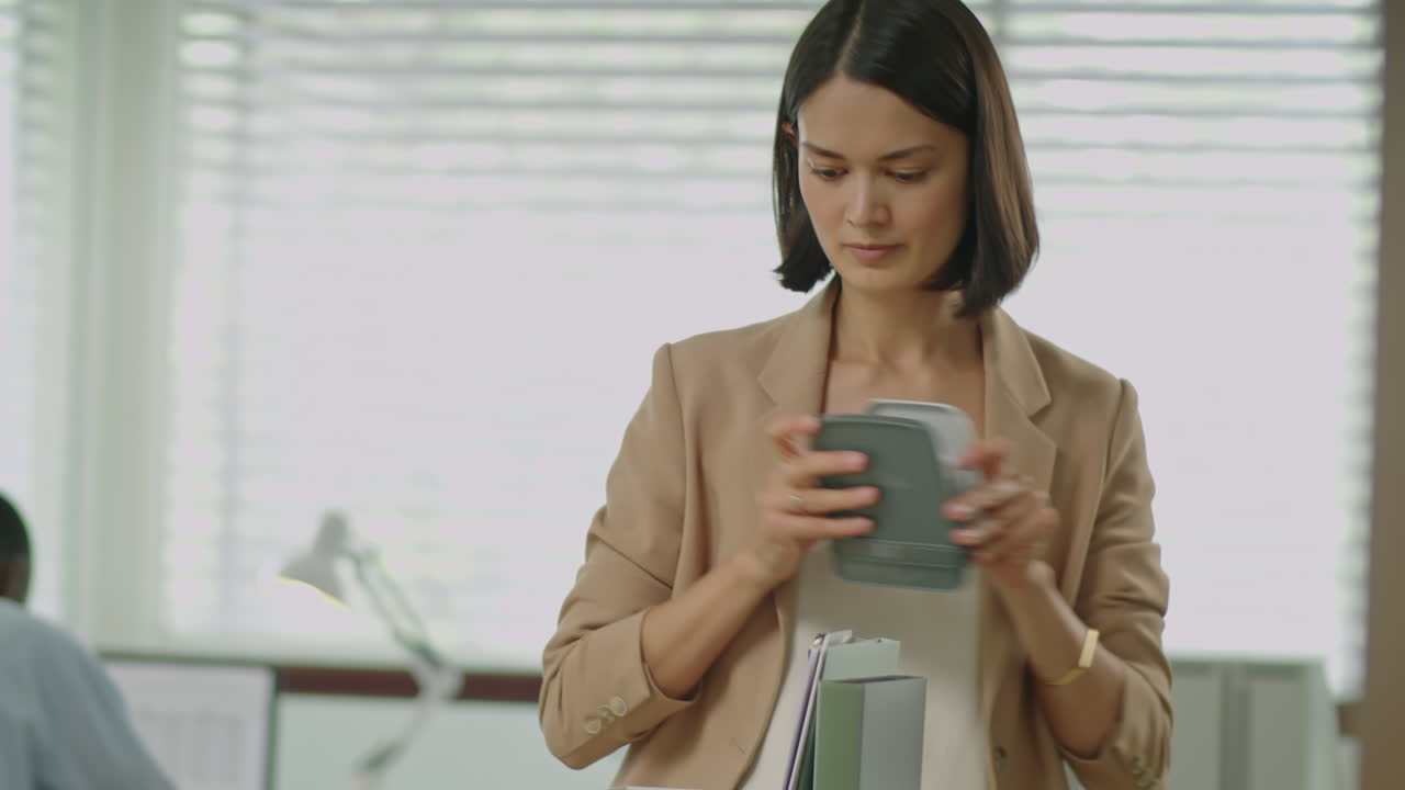 Fired Businesswoman Packing Stuff before Leaving Workplace