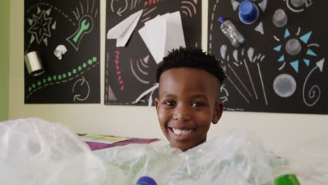 boy holding a recycling crate