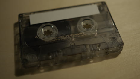 close up panning shot of cassette tape with blank label