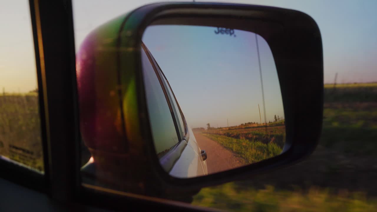 Driving on a Country Road at Sunset