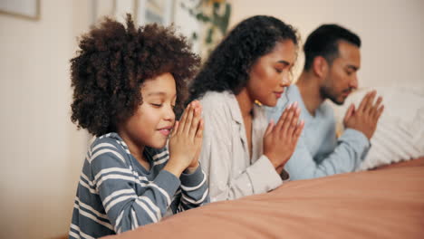 family praying together