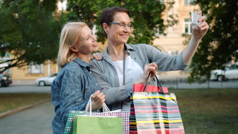 Two Women Taking a Selfie After Shopping