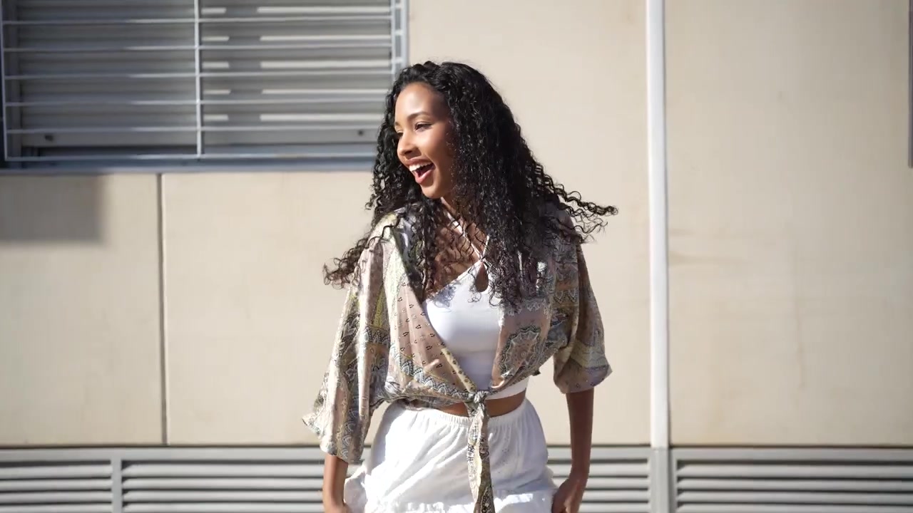 Experiencing a joyful dance expression while embracing flowing fashion styles together