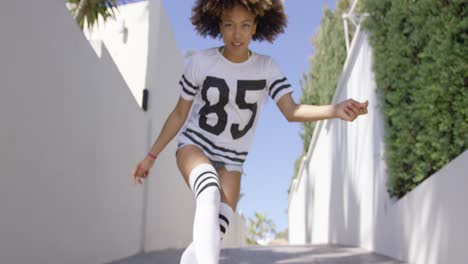 female walks on the sidewalk