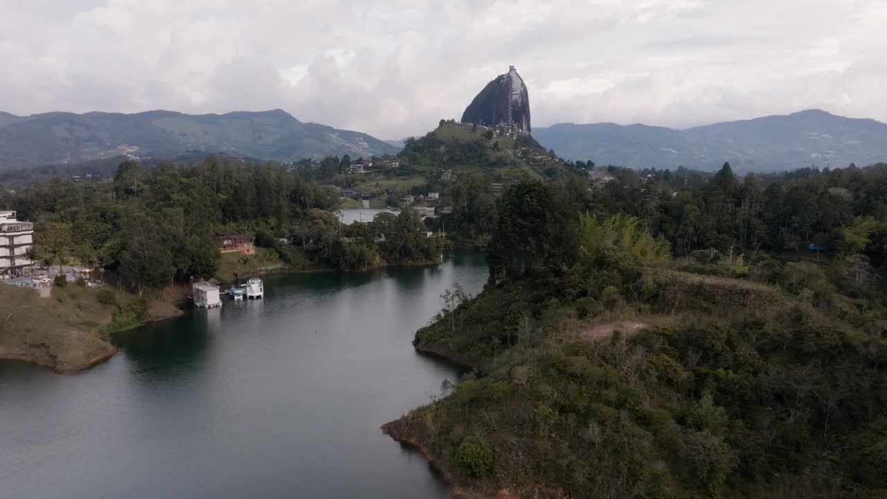 Drone shot of El Peñón de Guatapé (La Piedra Rock) with lakes and mountains