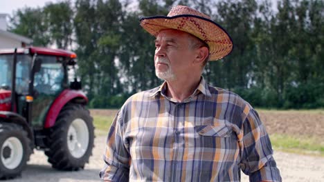 Portrait-of-serious,-senior-farmer-on-the-farm