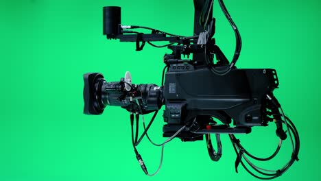 the camera jib is moving in a professional green screen studio. film and television industry