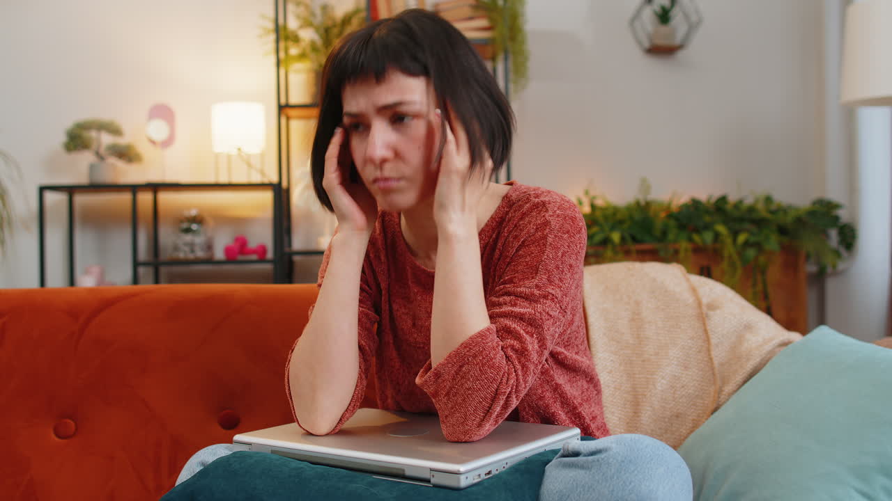 Angry woman using laptop working loses becoming surprised sudden lottery results bad news loss fail