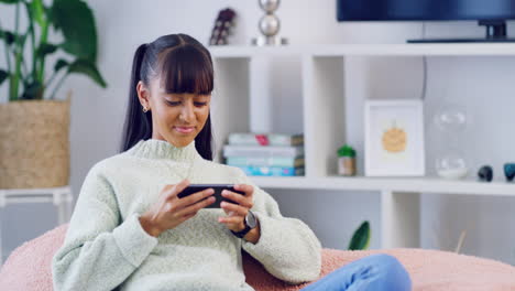 Trendy-female-gamer-using-phone-to-stream