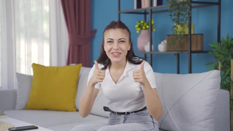 Young-woman-giving-greeting-and-applause-to-camera.