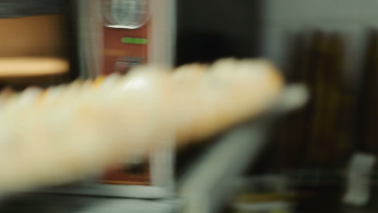 Pizza Baking In The Oven. Take out pizza from oven at restaurant kitchen