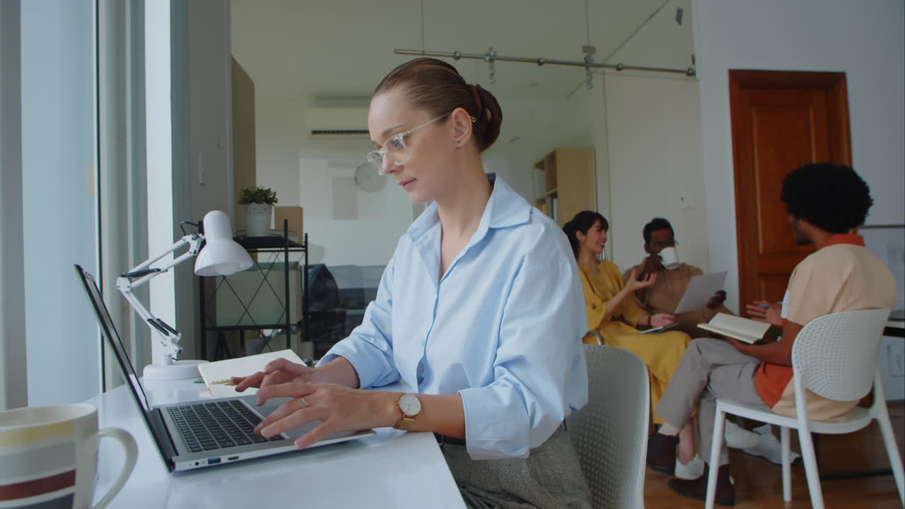 Female Caucasian IT Specialist Working at Office